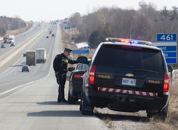 OPP giving distracted driving ticket